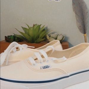 Cream and navy blue vans